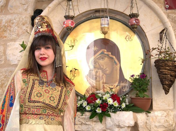 PalCatholic's tweet image. A Palestinian girl in the traditional Bethlehemite dress at the Bethlehem Icon Center.
