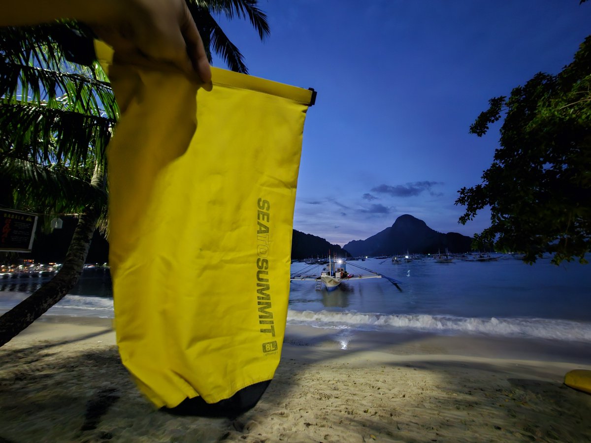 1brwn's tweet photo. The sun has set in El Nido, and so has the service of this once-trusty yellow dry bag that traveled with me across Asia.

After years of adventure, it will rightfully retire in El Nido. It has done its job well, and now it’s time to let it rest where it all started. https://t.co/5QnG46Amkd