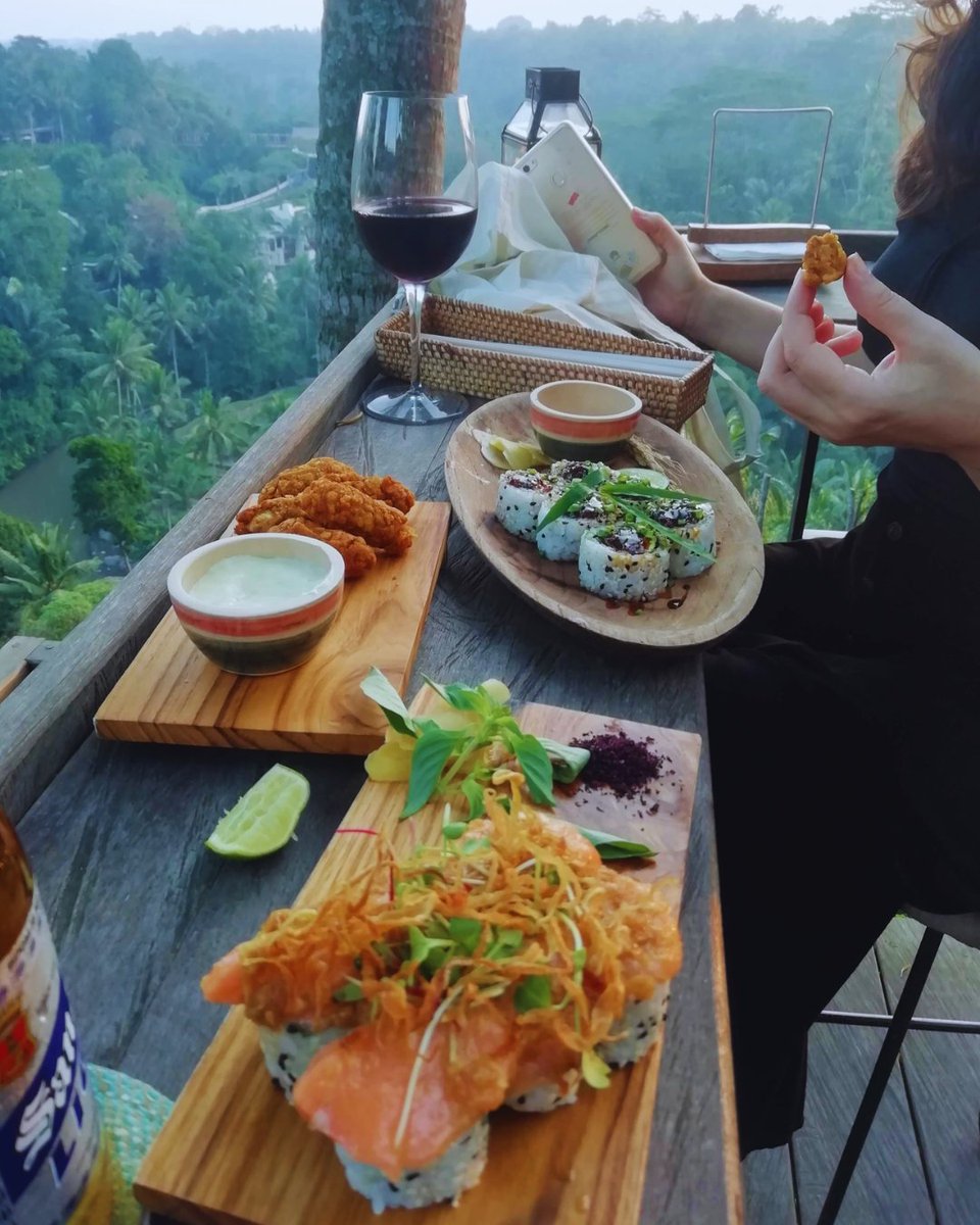 Travel_For_Food's tweet photo. Red wine in hand, a platter of sushi on the table, and nothing but green jungle as far as the eye can see. We could get used to these "jungle fusion" dinners!
.
.

#TravelForFoodHub #vacationmode #sushitime #travelgoals #outdoordining #eatlocal #foodculture #travelgram #localeats https://t.co/RWKh1bfYvC