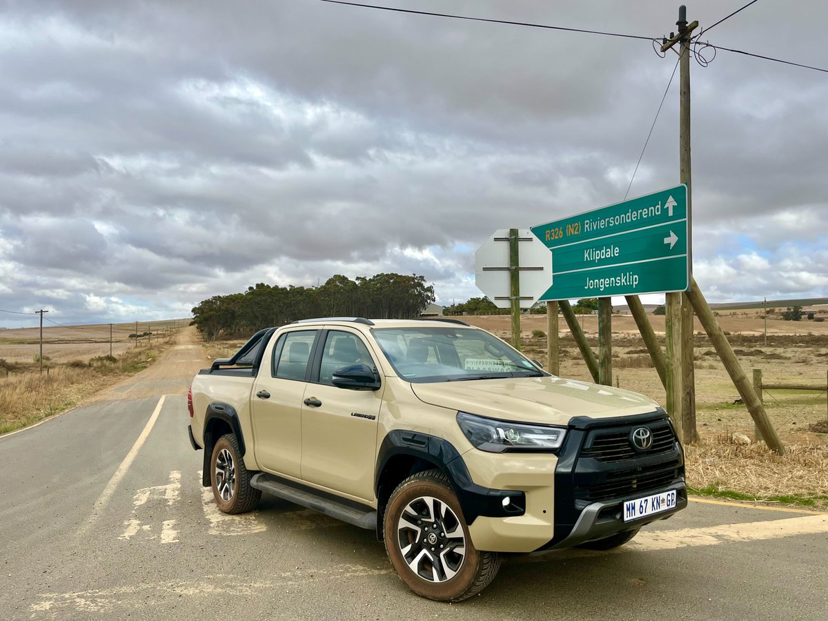 AutoTraderSA's tweet photo. We're hitting the tar! 🚙 Our annual Hermanus to Stilbaai road-trip in the @ToyotaSA Hilux Legend 55—the last "old" Hilux before 2026's reinvention. N2 &amp; dirt roads, December adventure mode: ON.
This or the new one? 🤔 
#ToyotaHilux #Legend55 #RoadtripReview #JapaneseCars https://t.co/D7YovtUczf
