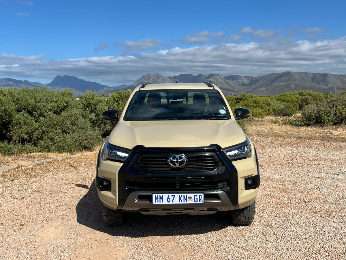 AutoTraderSA's tweet photo. We're hitting the tar! 🚙 Our annual Hermanus to Stilbaai road-trip in the @ToyotaSA Hilux Legend 55—the last "old" Hilux before 2026's reinvention. N2 &amp; dirt roads, December adventure mode: ON.
This or the new one? 🤔 
#ToyotaHilux #Legend55 #RoadtripReview #JapaneseCars https://t.co/D7YovtUczf