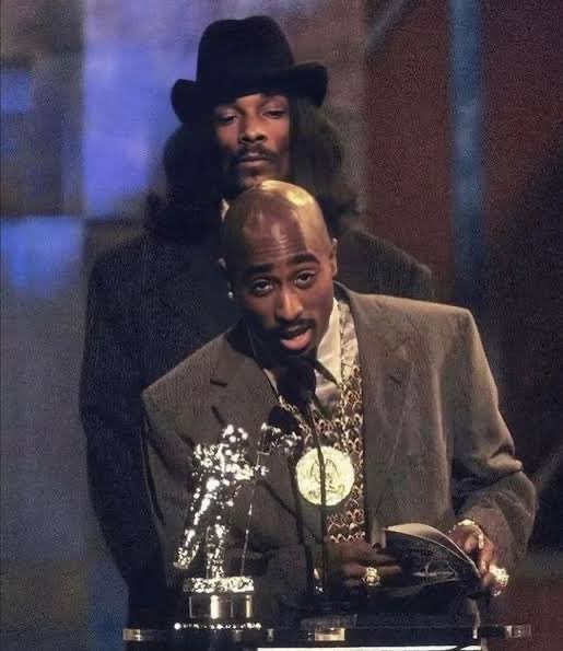 B1GPOPZ's tweet photo. @Raindropsmedia1 Snoop always talks from the safe side of history. Pac lived it.
Hit ’Em Up wasn’t about being “untouchable,” it was raw truth and war energy.
Pac outworked, outthought, and outgrew Snoop in every lane of music, message, impact.
Legends don’t play it safe. https://t.co/Z1ks5iXTGa