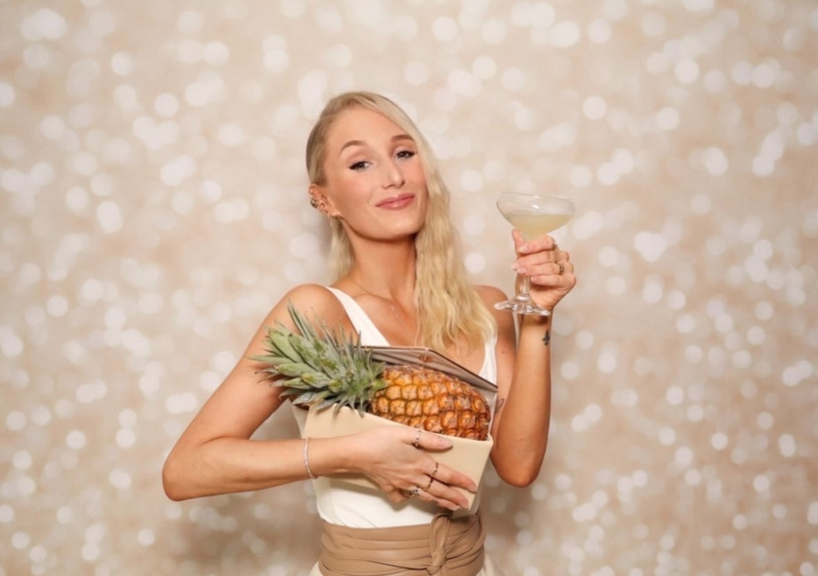 The only photo I have from my work Christmas party is of me proudly showing off the pineapple I stole.