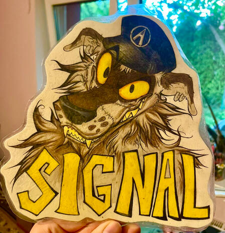 old badge i made some time ago- i somehow managed to laminate it

WITHOUT a laminator 😭😭😭 in that way i destroyed a rlly good art with shitty plastic over it- and that art is traditional

its still on my wall cuz idk what to do with it
