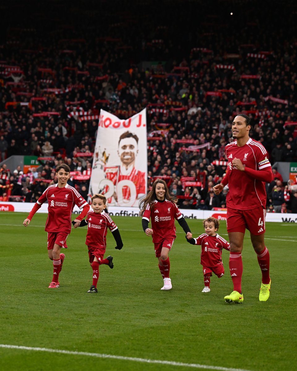 LFC's tweet image. Two of Diogo Jota’s children - Dinis and Duarte - as well as family members, are mascots ahead of the match between their father’s English clubs ❤️