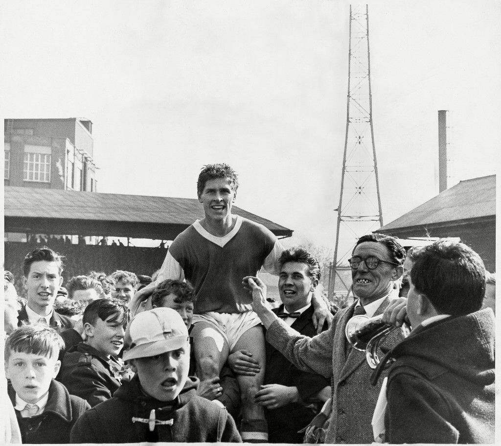 A memorable photo from yesteryear with Ray Crawford getting carried off the pitch. #itfc