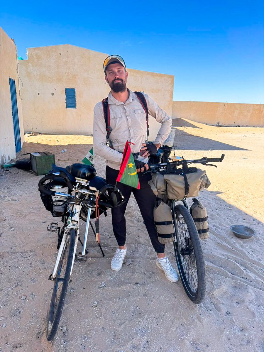 emmiwuks's tweet photo. DAY180 NIG2USA ON A BICYCLE 🇳🇬🚴🇺🇲
I just met Samuel, an international cyclist from FRANCE. He’s riding all the way down to South AFRICA. 
We stopped for a while, shared stories, routes, fears, and survival tips on this long African road. He told me some scary things, the kind of stories that can shake your mind out here, but honestly, fear no dey stop this journey.

Out here, courage is not the absence of fear, it’s choosing to move anyway.
Different countries, different accents, one road, one spirit.

Africa, please be kind to Samuel.
The road is long, the desert is honest, and the journey humbles everyone.

To every cyclist chasing a dream on this continent, I see you........ 🚴🏽‍♂️🌍
Together we Ride. Together we Rise.
From Nigeria to USA............. 🇳🇬🚴🇺🇲

#NIG2USA #adventure #tourism #Africa