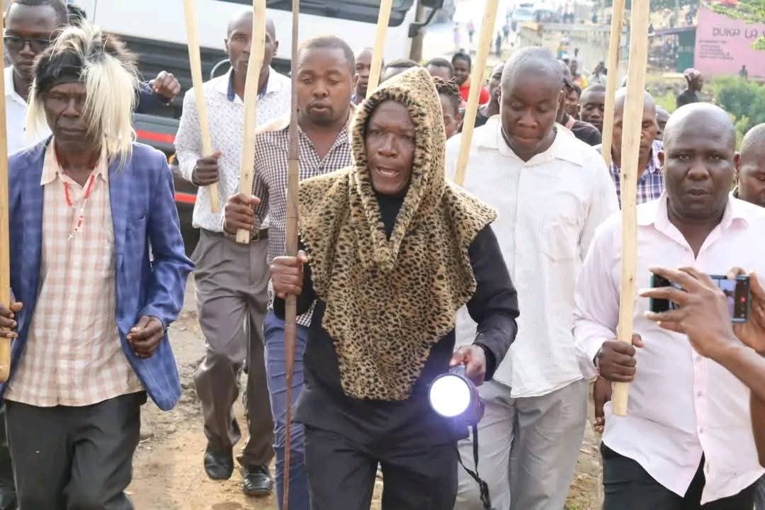 timothyturunga's tweet image. Senator Boni Khalwale carries the torch that will be placed inside Cyrus Jirongo’s coffin.
