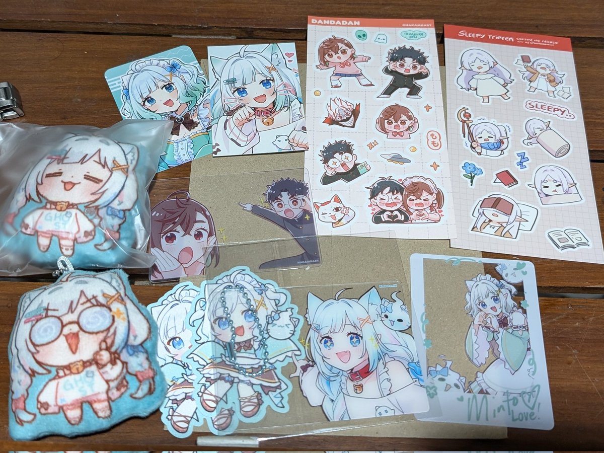 RenjiMD's tweet photo. #CosMatsuri2025 haul was only @KamiiRkgk art and stuff! Recently finished Dandadan and Frieren (S2 next month!) hence the merch...and of course, Minto...in Kamii's art...*chef's kiss*🎄🎅 https://t.co/WaT4e9XBlE