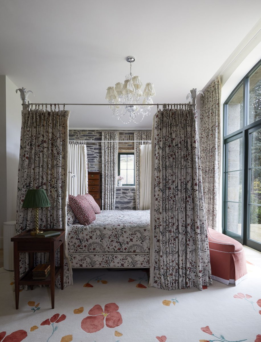 Washed in soft pink, this ensuite balances warmth and restraint. Honeyed oak, patterned textiles and antique furniture lend depth, while the Spey bath frames open field views. The Spittal shower adds a calm, architectural note within this Dublin castle retreat by Suzie Mc Adam.