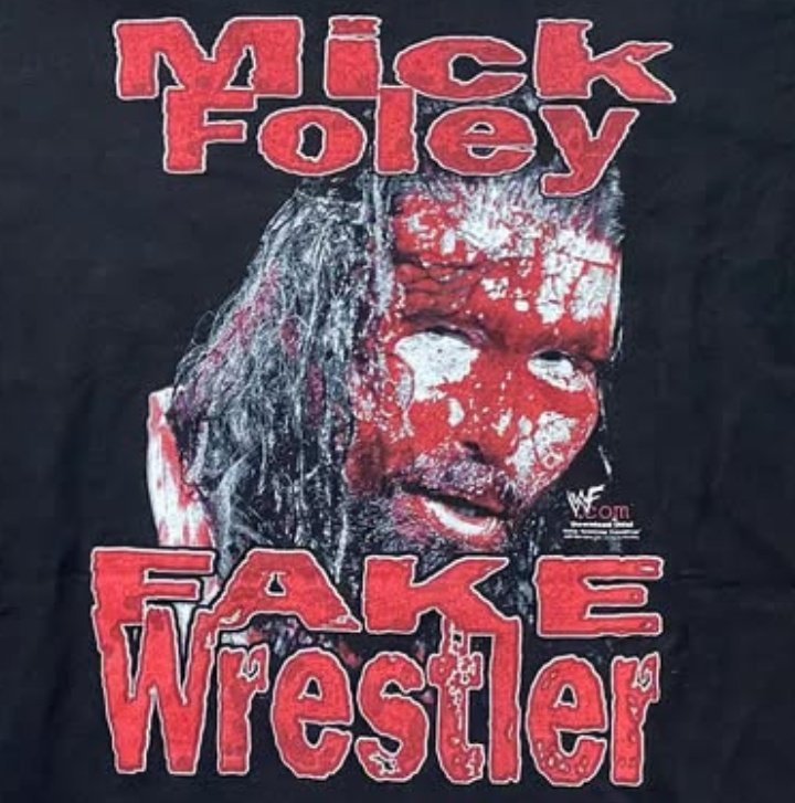 ashstabbath's tweet image. Love this deeply passive aggressive Mick Foley shirt from the last gasps of the kayfabe era