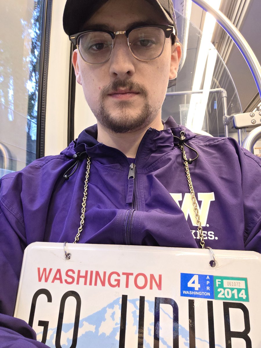 Tmatershow's tweet photo. I wonder why I'm getting weird looks on the light rail. Doesn't everyone have a GO UDUB license plate they wear to @UWAthletics events? https://t.co/Yz2sqZLOU3