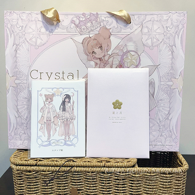 新刊限定セットの紙袋です。
図2は手帳とポストカード（5枚入り）
#C107