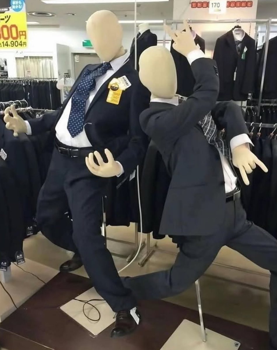 Japanese Mannequins Posing to Prove their Suits Don't Rip