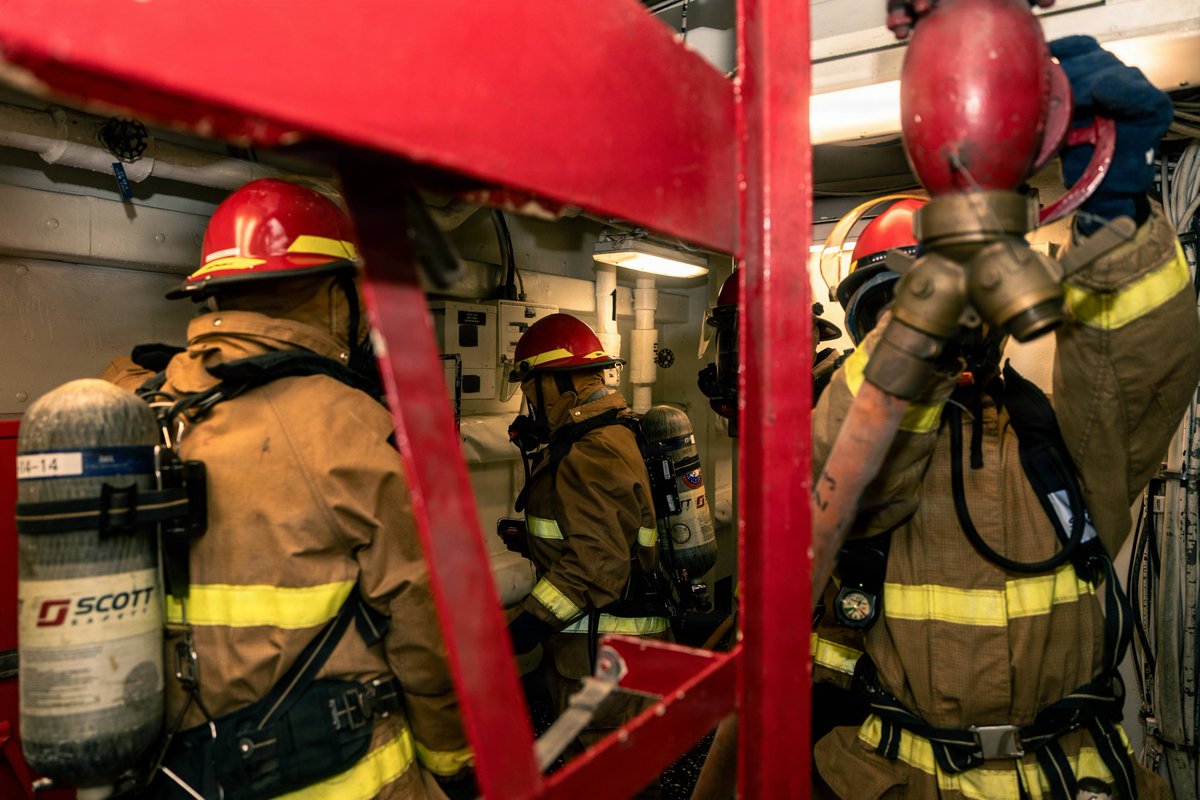 USNavy's tweet photo. Trial by Fire 🔥
Sailors assigned to the Whidbey Island-class dock landing ship USS Gunston Hall (LSD 44), with support from Navy Region Mid-Atlantic Fire and Emergency Services, conducted an 8010 validation exercise, Nov. 21, 2025.
The exercise evaluates the ship’s ability to respond to a fire in an industrial environment, assessing its emergency teams, firefighting capabilities, and integration with external responders in preparation for an upcoming maintenance period.