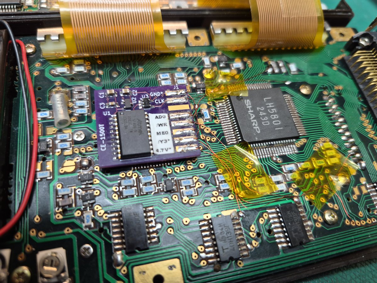 The CE-1500T 'turbo' for the Sharp PC-1500 lives! I can now programmatically switch between a 1.3mHz and 2.0mHz clock with a simple POKE. Note hi-tech method of keeping ribbon from rubbing PCB :)