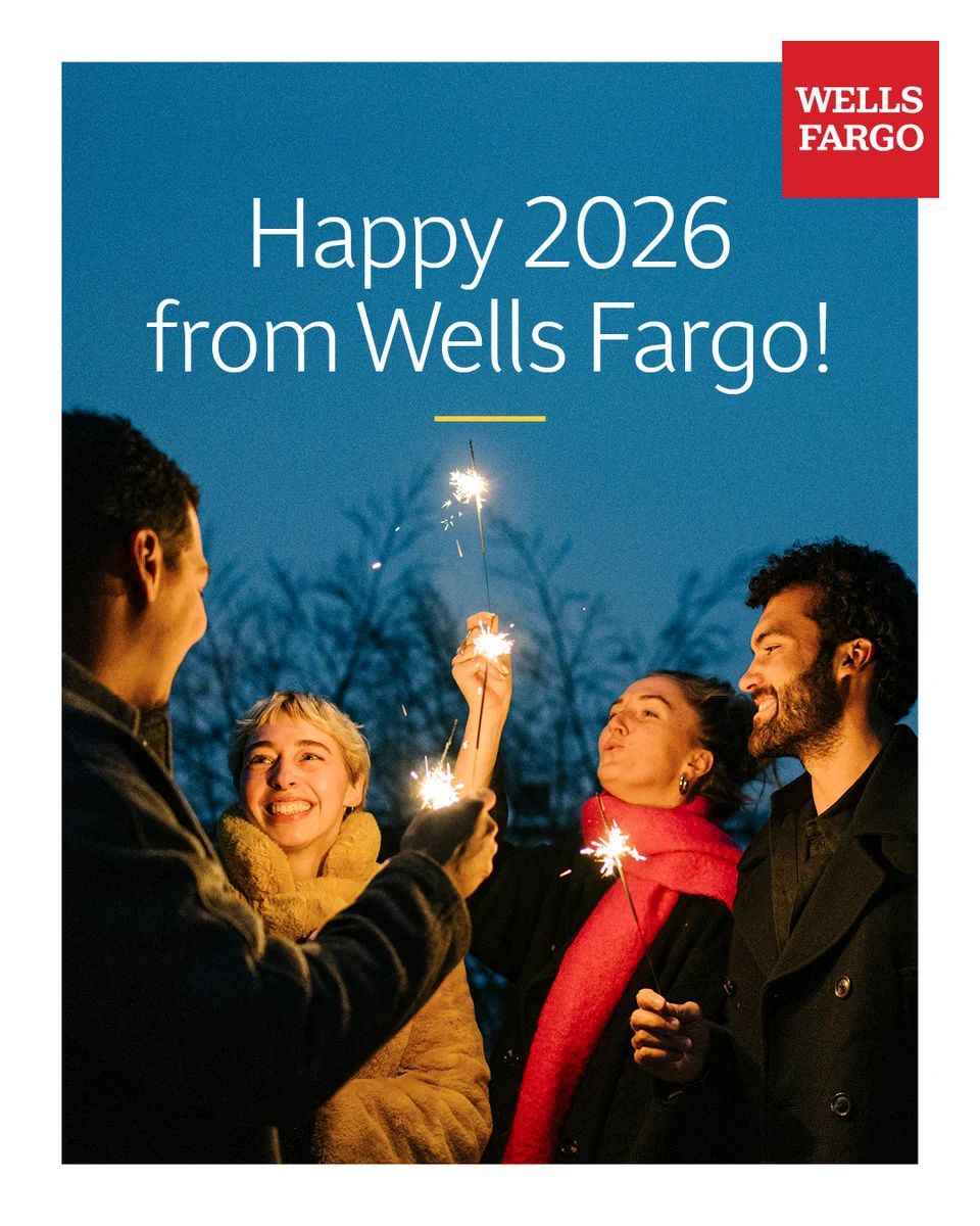 Group of people holding sparklers outdoors at dusk with text that reads ‘Happy 2026 from Wells Fargo!’ and the Wells Fargo logo in the top right corner. 