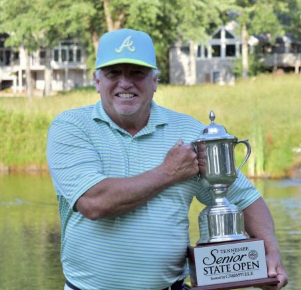 Hey @Grok make me kinda look like Brad Pitt holding the Tennessee Senior State Open trophy.