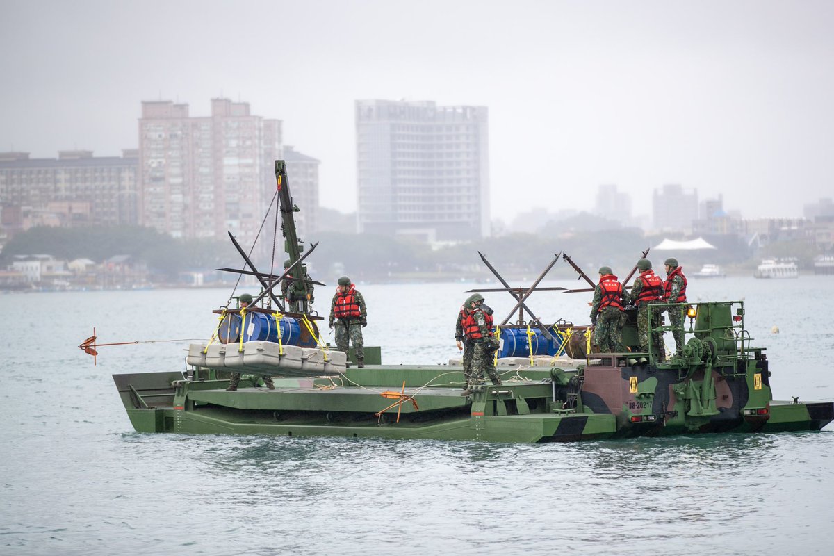 sentdefender's tweet photo. Soldiers with the 53rd Engineer Group of the Republic of China Army conduct a river blockade drill on the Tamsui River in the area of New Taipei City, Northern Taiwan, simulating the deployment of mines, barriers and other means which would be used to thwart an attempted amphibious landing by the Chinese People’s Liberation Army against the Taiwanese capital of Taipei.