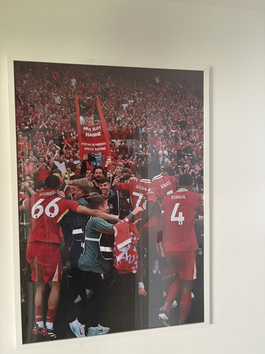 Moment of the year hangs proud in the hallway! 
My boy dancing with the reds with the biggest smile I’ve seen when we was confirmed as kings of England once again! 
I’m somewhere in the background in that sea of red in the watching down crying like a baby! ❤️❤️❤️