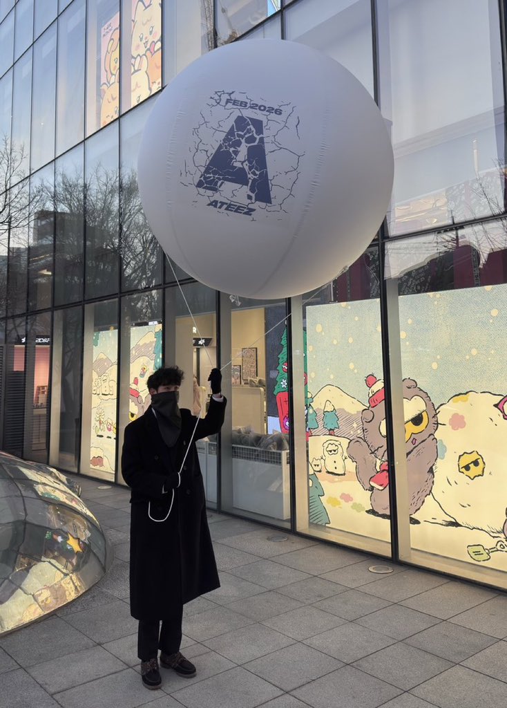 kchartatzmaster's tweet image. A man holding an ATEEZ balloon with “Feb 2026” has been spotted in Hongdae