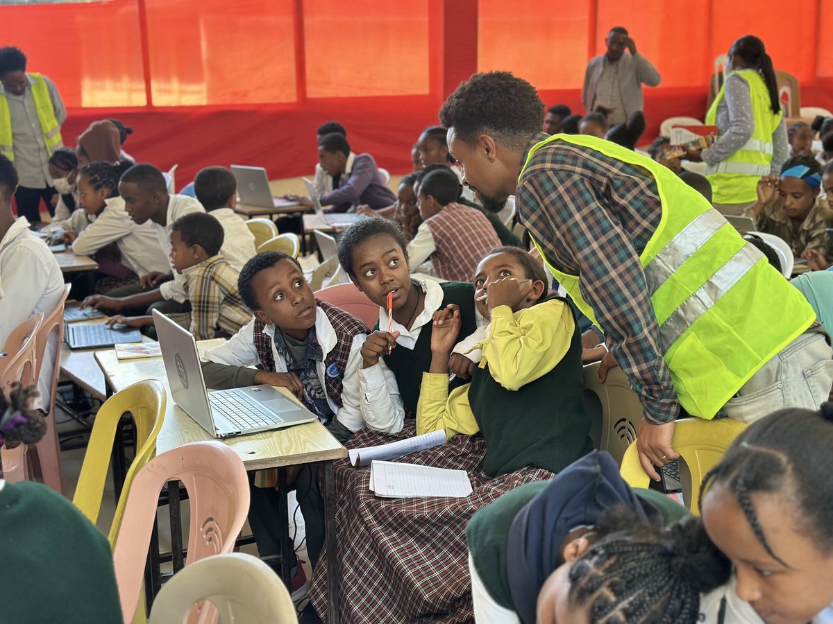 Kal-Kidan from dan !  

Leans in to guide Enthusiastic young Ethiopian students during a hands-on coding session in a community classroom, sparking curiosity and tech skills among bright minds eager to learn. 

dan Empowering Line !