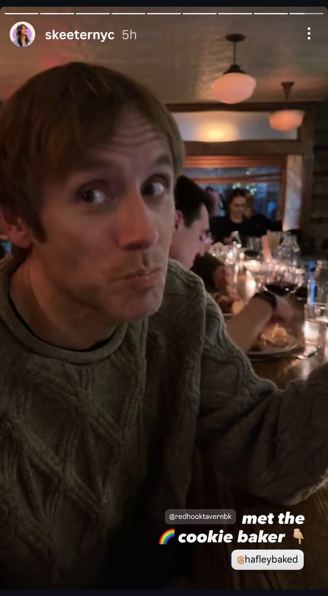 geoff rickly in a sweater with the sweetest face in the world eating a rainbow cookie I'm ending this year clutching my chest in adoring agony Btw