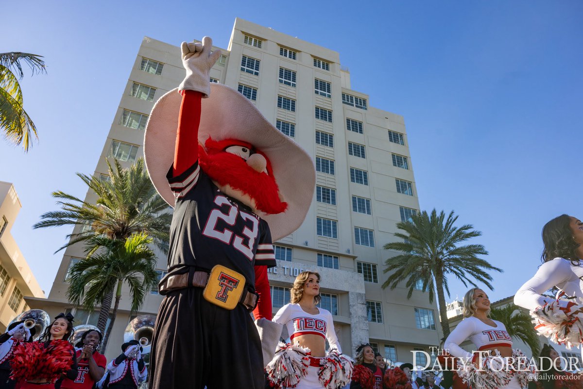 The Goin’ Band from Raiderland and the Oregon Marching Band perform on Ocean Drive at the Orange Bowl Pep Rally Parade ahead of the Capital One Orange Bowl set to kick off at 11 a.m. Thursday.