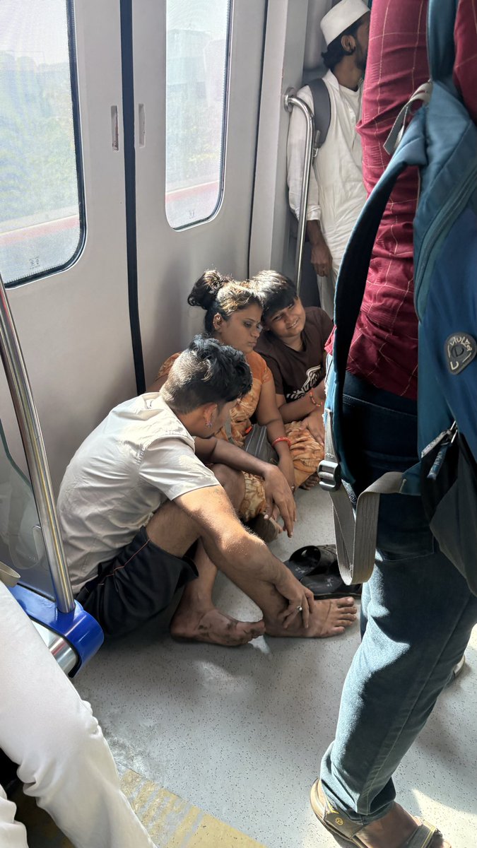 Kunalas461's tweet photo. @MumbaiMetro01 is this accepted in metro ?
They are sitting and passengers are getting inconvenience to stand properly. #mumbaimetro #ghatkopar https://t.co/rZrQi1xBCf