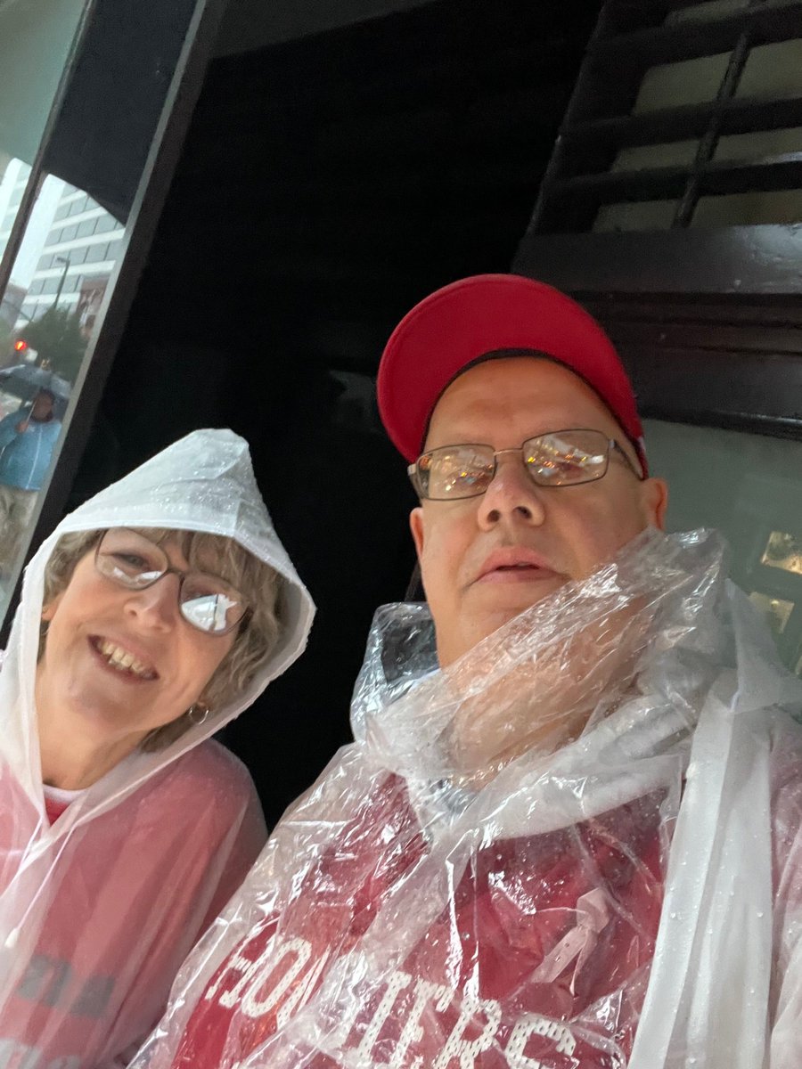 Waiting out the rain before the parade begins.