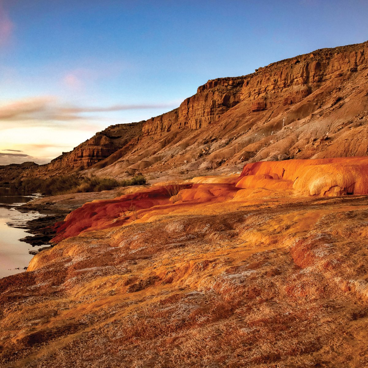 utahgeological's tweet photo. Happy New Year from the Utah Geological Survey! May 2026 bring you closer to Utah’s unique landscapes.

Sunset glows on the travertine terraces of Crystal Geyser, formed by carbonate-rich water precipitating into limestone near the Green River.

Photo by Stormie Elmer https://t.co/PI36DgarjX