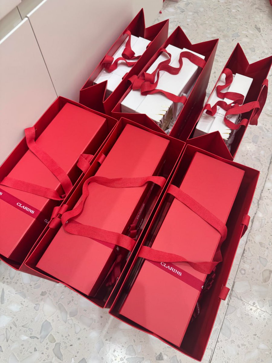 "An explosion of elegance! 🎁✨ Red gift bags ready to spread joy and cheer. Who’s excited for unwrapping surprises? 😊❤️