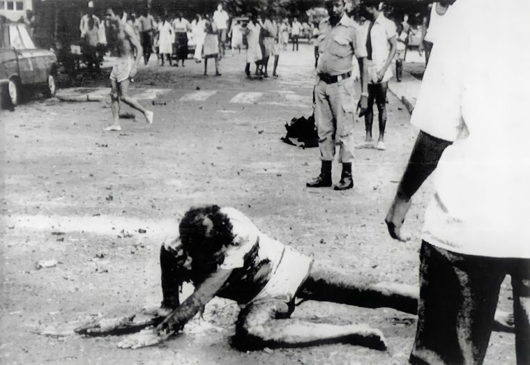 HistorySAZAR's tweet image. April 7, 1988: A grievously injured Albie Sachs struggles to raise himself from the street after the detonation of a massive car bomb in Mozambique planted by South African agents. He barely survived the brutal attack, but his shattered right arm could not be saved, and he lost…