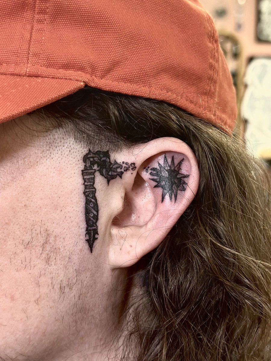 Got me a flail/mace tattoo right there, right up in the ear kinda on my face