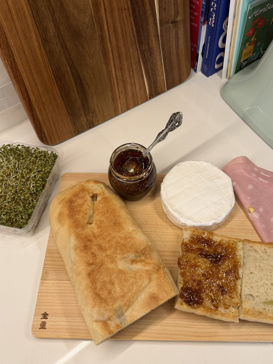 paularambles's tweet image. in 2026 we’re sandwichmaxxing (brie, mortadella, fig jam, clover &amp;amp; alfafa sprouts on a green onion slab from acme bread)
