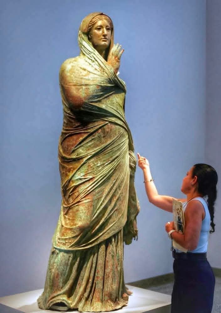 "Lady of Kalymnos", a magnificent, nearly fully preserved ancient Greek bronze sculpture of a woman. It is a Hellenistic-era creation, estimated to date from around the 3rd Century BC. 

The statue was discovered unexpectedly from the sea near the island of Kalymnos in 1994 or