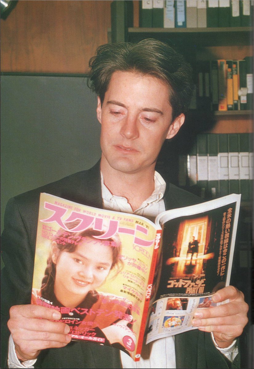 objectfetishist's tweet image. Kyle Maclachlan reading Japanese magazines during a visit to Japan in the early 90s. Scanned from “Kyle Maclachlan: Mysterious Prince.”
