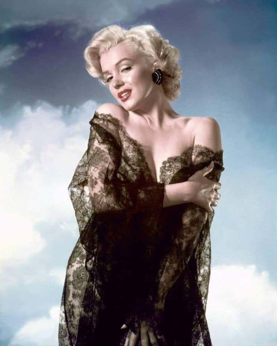 Marilyn Monroe wearing black lace--doing exactly what it was designed to do. (1952)