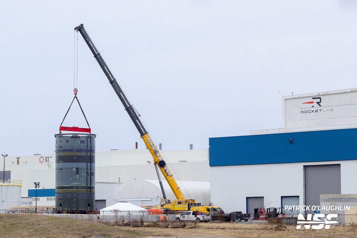 After 24+ hours, the hardware is still upright and attached to the crane. It appears to have been rotated. Work is continuing at its base.