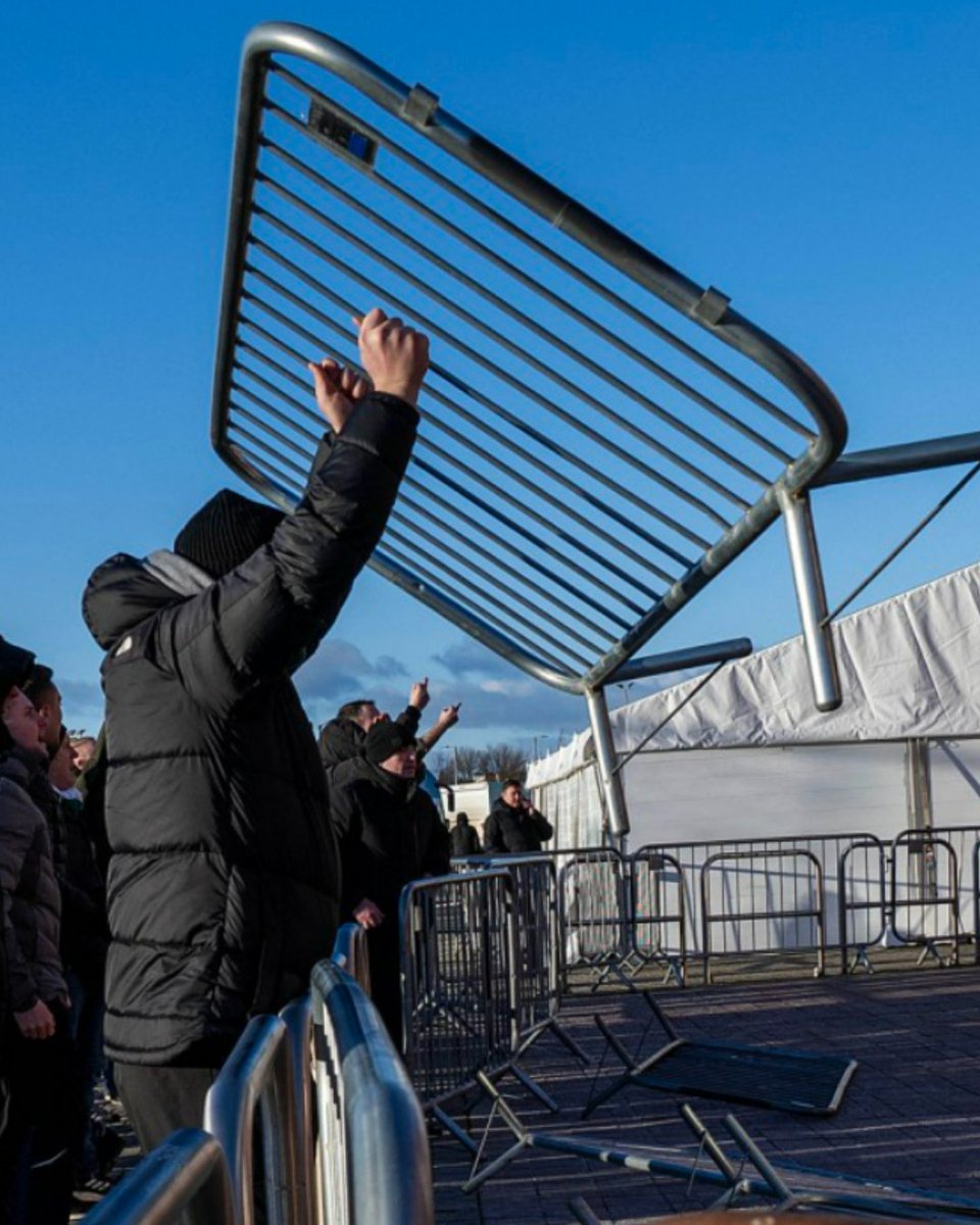 A raging Celtic fan picks up a railing during today's protest - or is it a shark? 🤔
