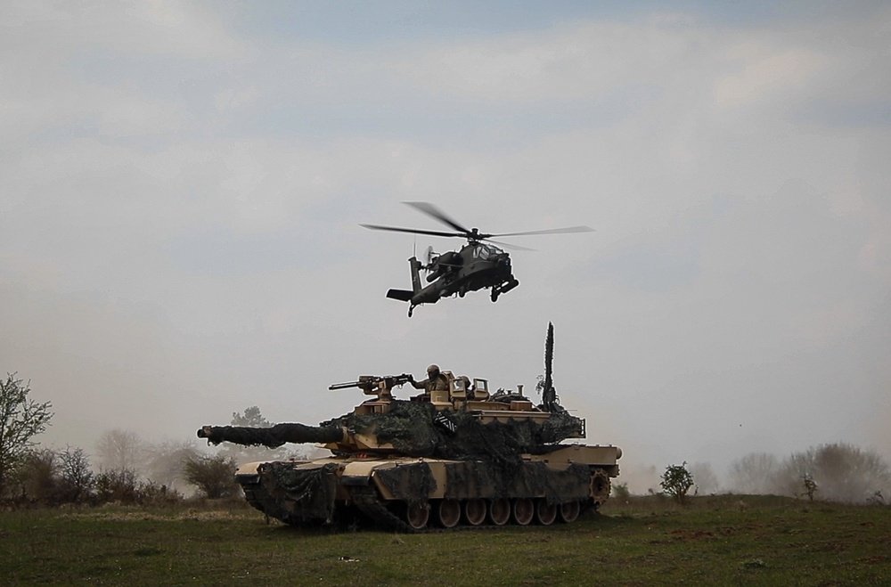An M1A2 Abrams and an AH-64 Apache helicopter during the Allied Spirit X exercise in Hohenfels, Germany, 13 April 2019.

Photo by: Sgt. Thomas Mort