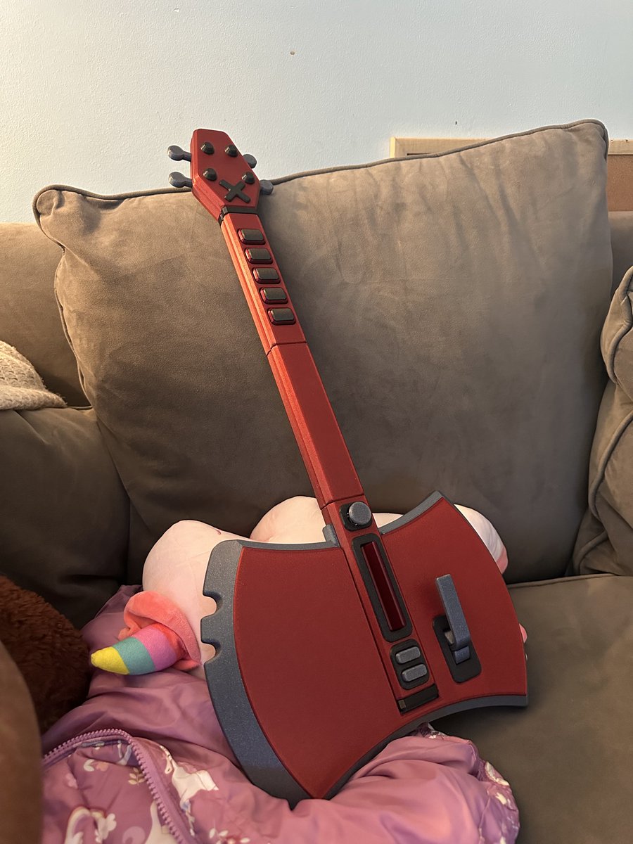 Acai28's tweet image. my daughter just got the coolest guitar hero controller from her uncle