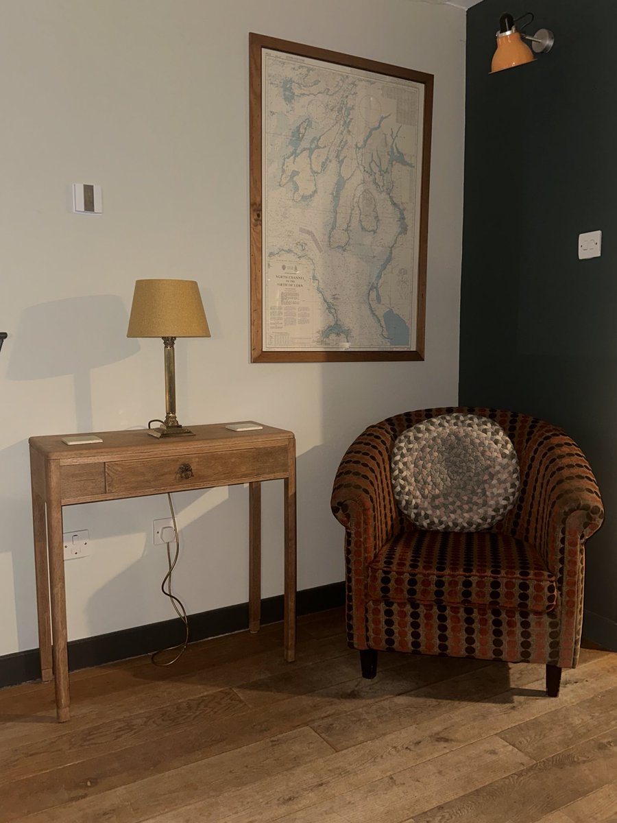 The reading corner, complete with overhead reading light, new console table and lamp