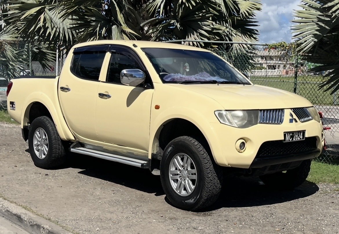 troydmccann's tweet photo. #carspotter Barbados edition.  Roads are narrow, driving is on the left, cars are tiny.  Goodies include Suzuki Ciaz and Swift, this Daihatsu mini moke, a butter-yellow Mitsu pickup, Toyota taxi vans in 3 sizes and a Corolla Axio with a rear wiper. Jimnys, but rental only.  #RHD https://t.co/59fOOKqKBz