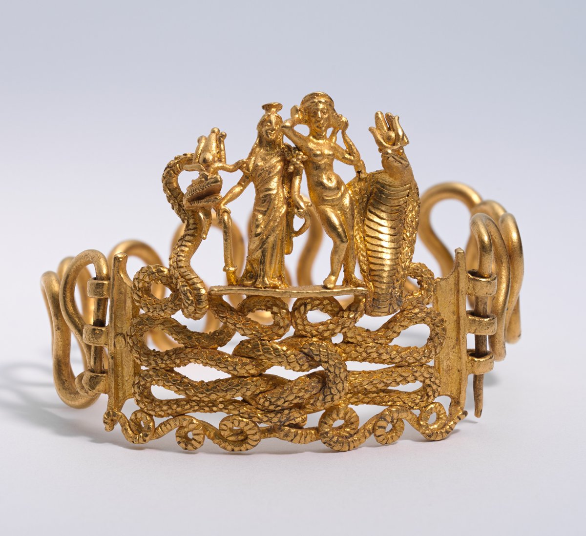 Bracelet with Agathodaimon, Isis-Tyche, Aphrodite, and Terenouthis. Period: Roman Period. Place of Origin: Egypt. Date: c. 1st century BC.–AD. 1st century. On view at The Met Fifth Avenue in Gallery 137, NY.