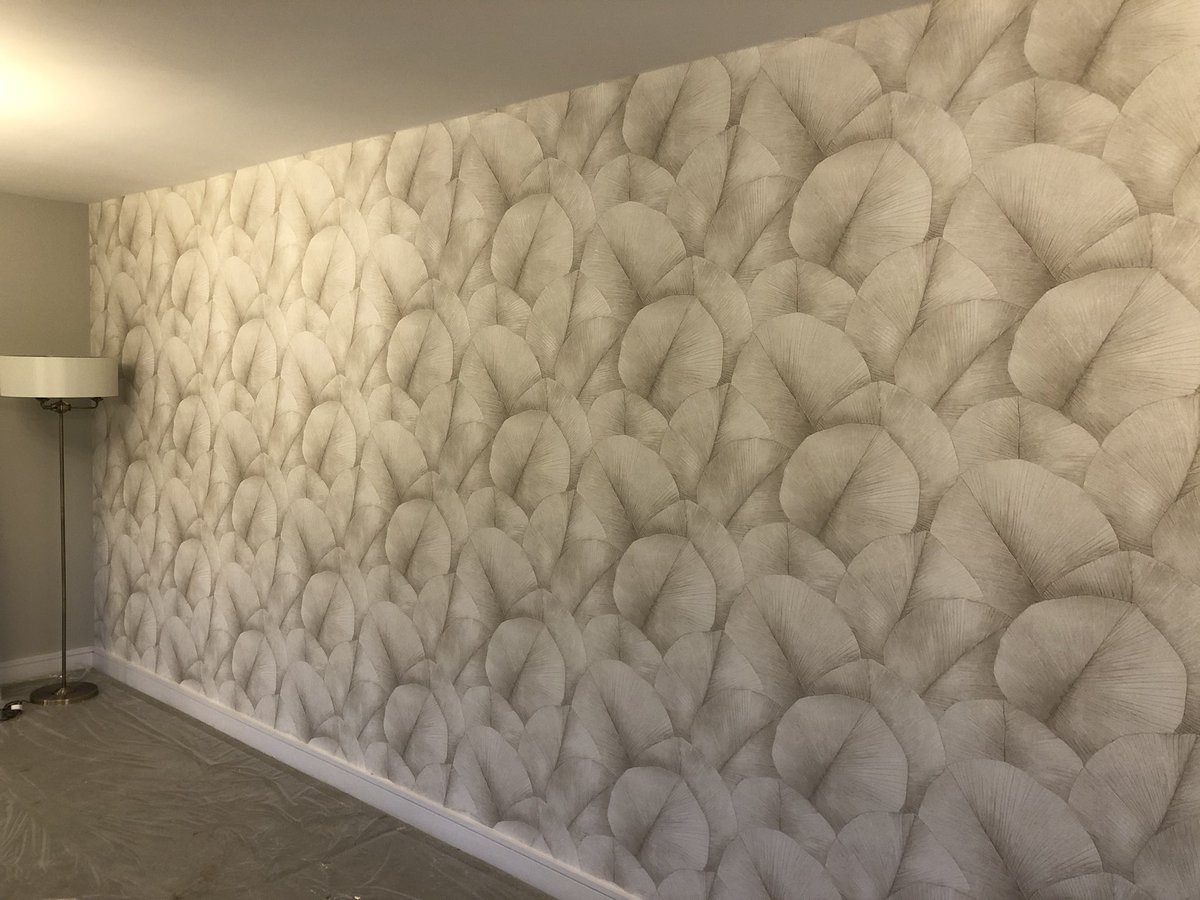 A few wallpapered feature walls in the show houses for the interior designer .