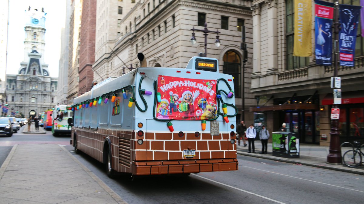 SEPTAPHILLY's tweet photo. The FESTIBUSES are back at Love Park THIS WEEKEND [weather permitting]! Stop by to see this year's amazing creations - including SUPER MARIO - then head to FESTIVAL OF TREES to cast your vote for the #SEPTA 🎄! #ISEPTAPHILLY #waytogo #FESTIBUS #philachristmas https://t.co/RgfoLOSJli