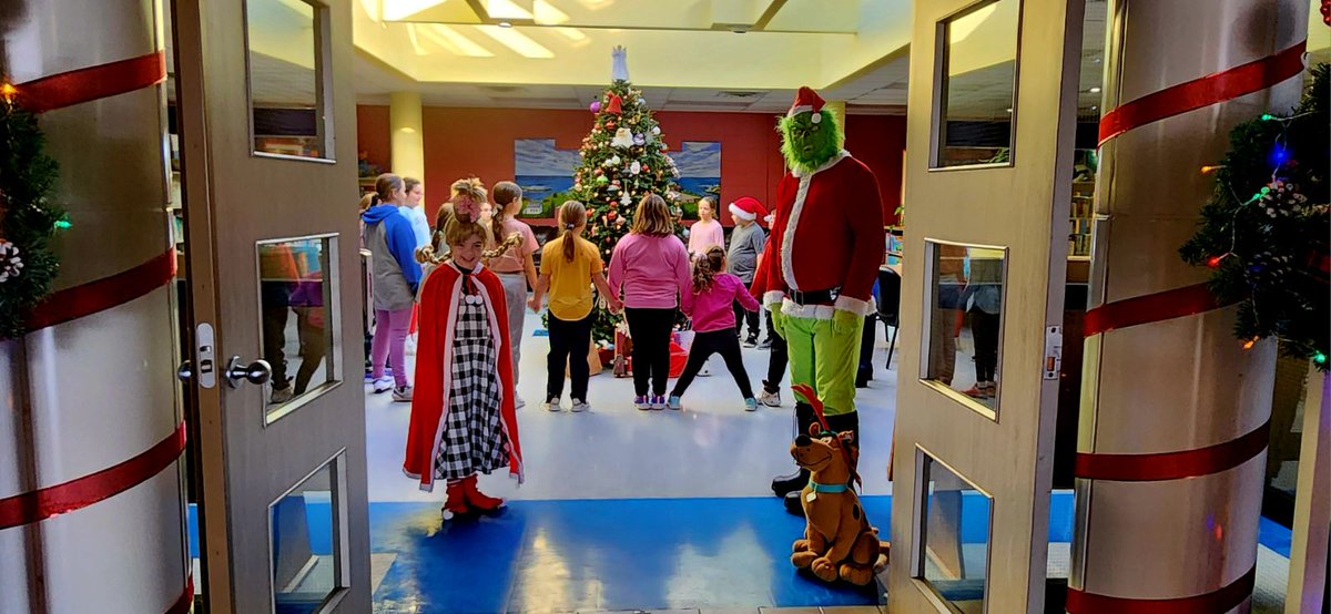 Tignish Elementary welcomed a surprise guest as the Grinch himself paid a visit. With Max, his loyal canine companion, and Cindy Lou Who in tow, they joined the students around the towering Christmas tree. Together, they sang carols and found a place in his heart Tignish.