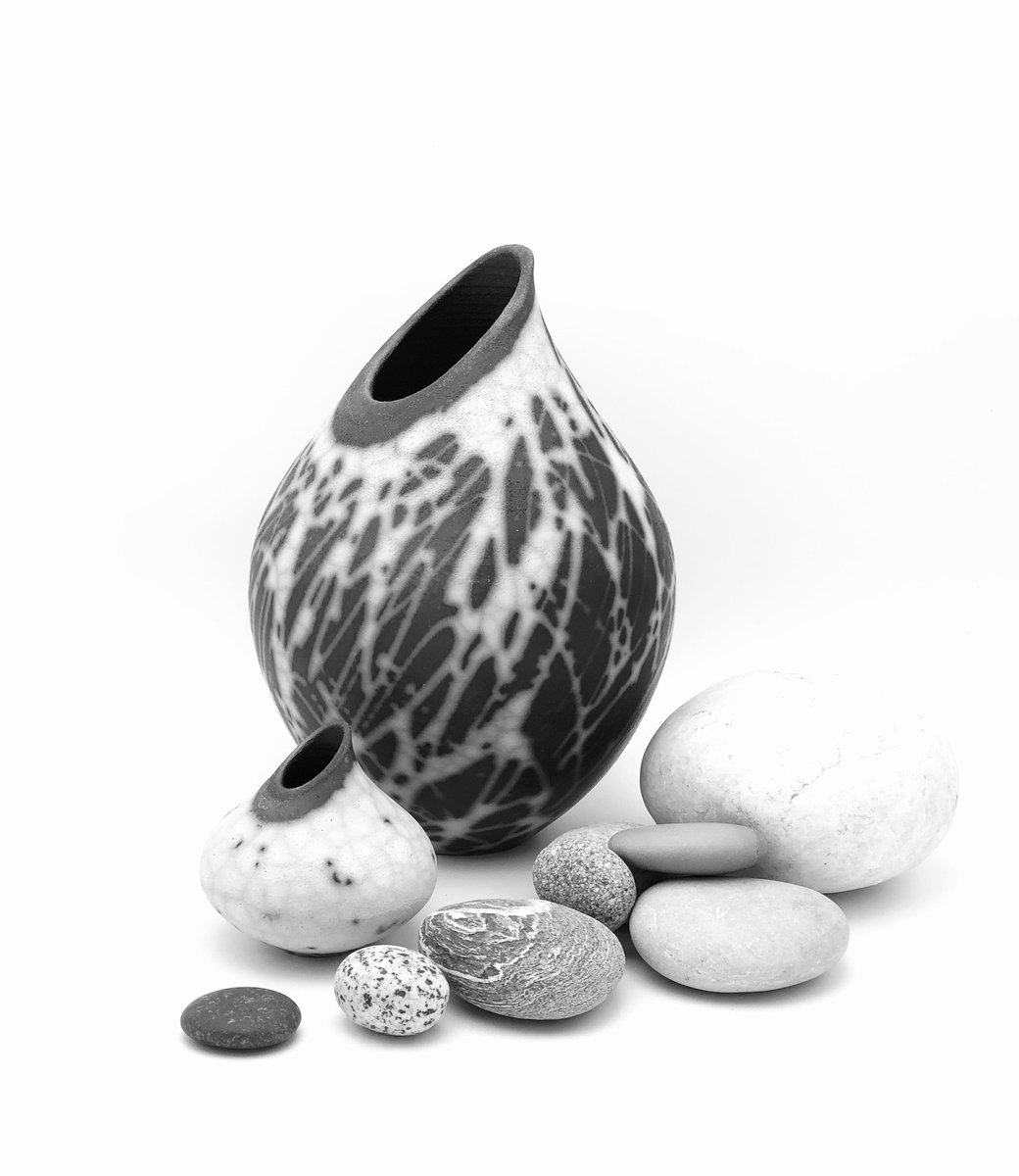 Naked Raku (white and smoke black) by acclaimed Canadian artist Kathleen Tennock. Primitively fired, clay pots, 9”and 3” tall - UP FOR BID until Dec. 9 at our online fundraiser! (stones not included) We ship!  #ceramics #pottery #art 32auctions.com/ReachStars2023