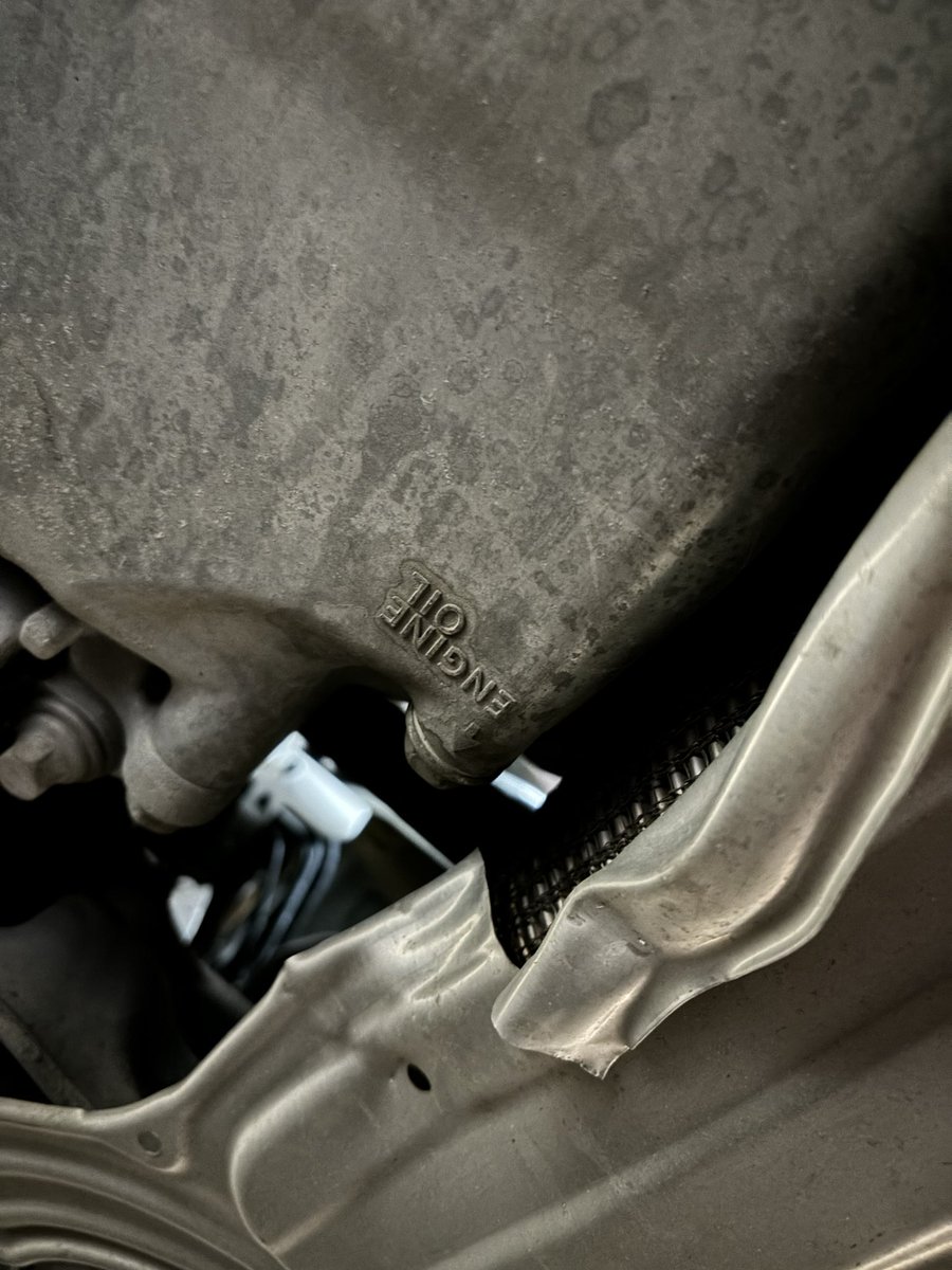 This is why you change your own oil… Instead of removing the aluminum plate under the car to get at the drain plug, they just cut the plate and bent it back. Oil changes are usually done at the dealer, but I can’t say for certain which one.  I’ve used 2.  🫤